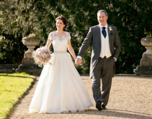 Bride with bouquet and groom